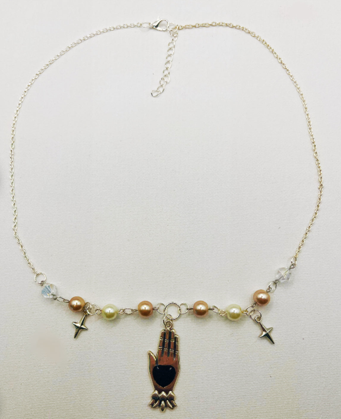 Black heart hand necklace