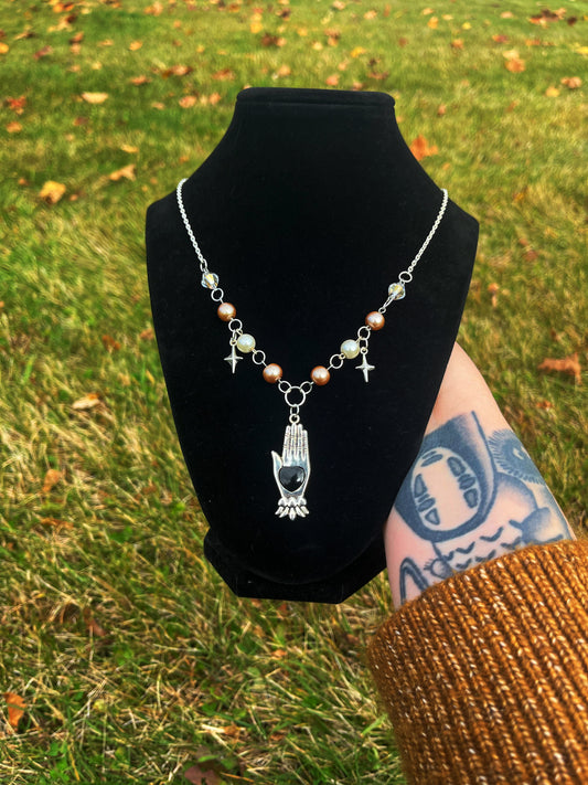Black heart hand necklace